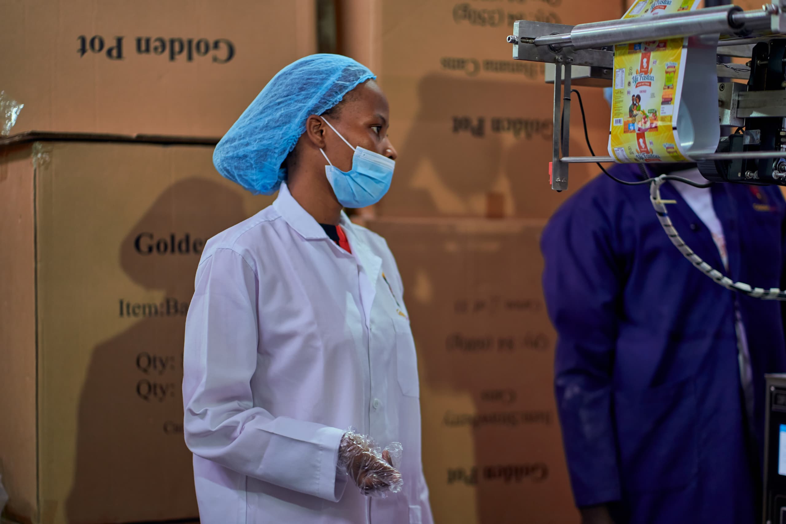 Quality control worker in Goldenpot production facility